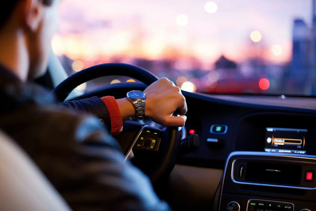 Driver at the wheel for a Jaisalmer taxi service transfer